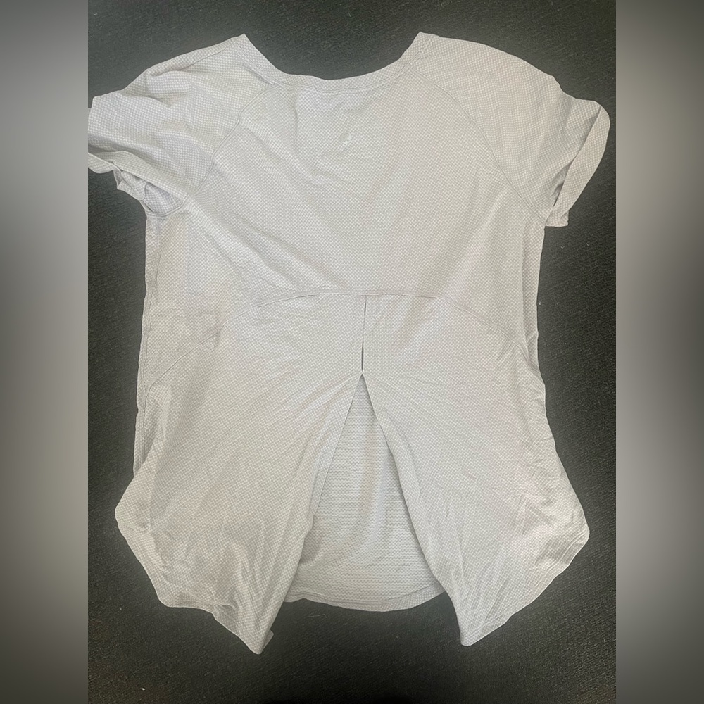 Lululemon short sleeve top. Greyish lavender size. Unknown size I think 4/6.